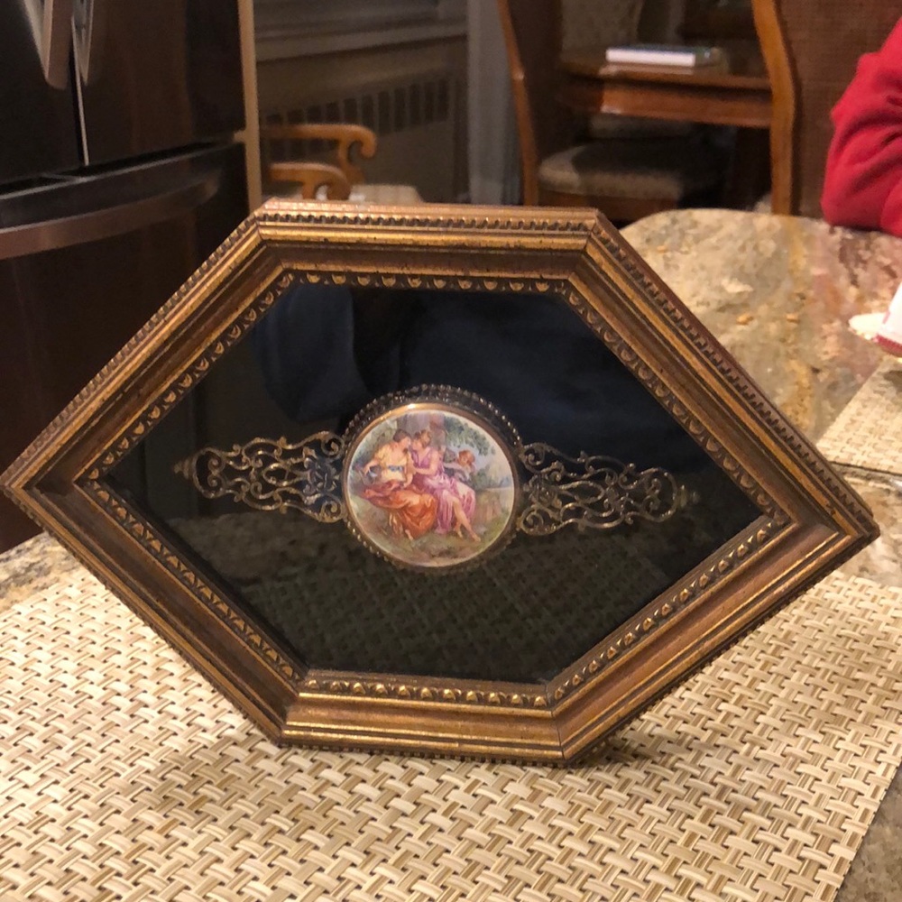 Traditional medallion plaques, gold frames, black background. Sold as pair